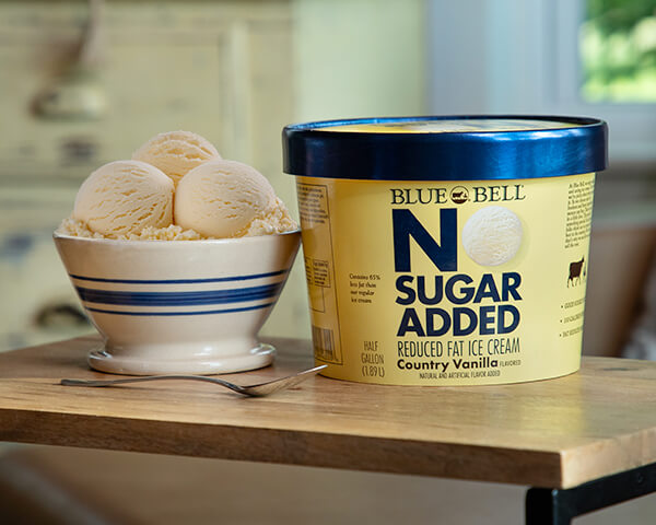 Blue Bell No Sugar Added Country Vanilla in bowl with half gallon