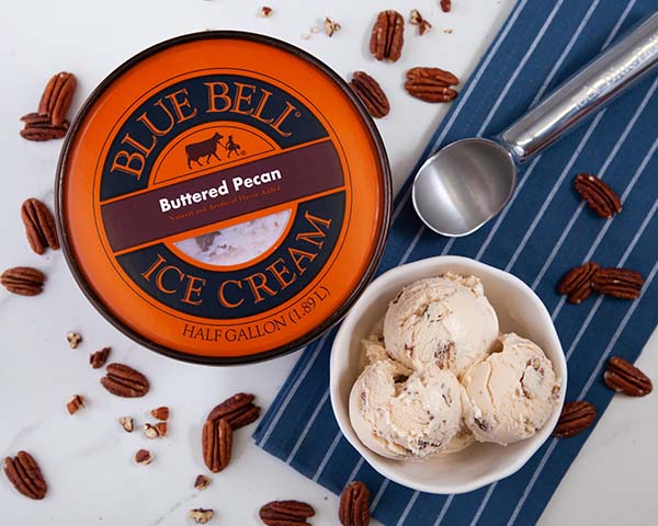 Blue Bell Ice Cream Buttered Pecan in bowl with half gallon