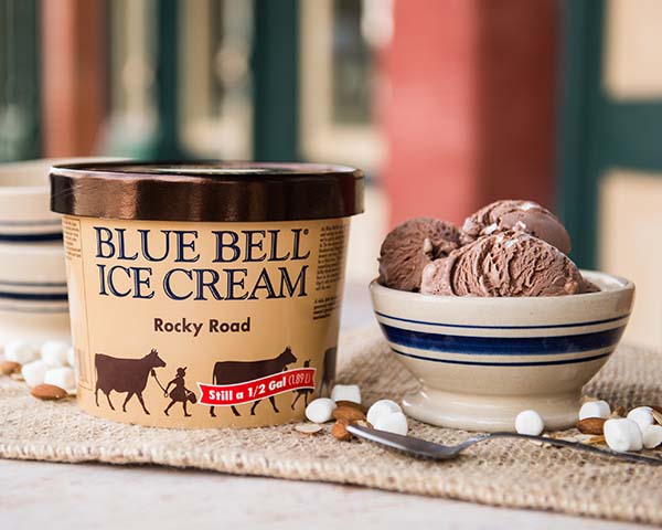 Blue Bell Rocky Road Ice Cream in half gallon with bowl of ice cream