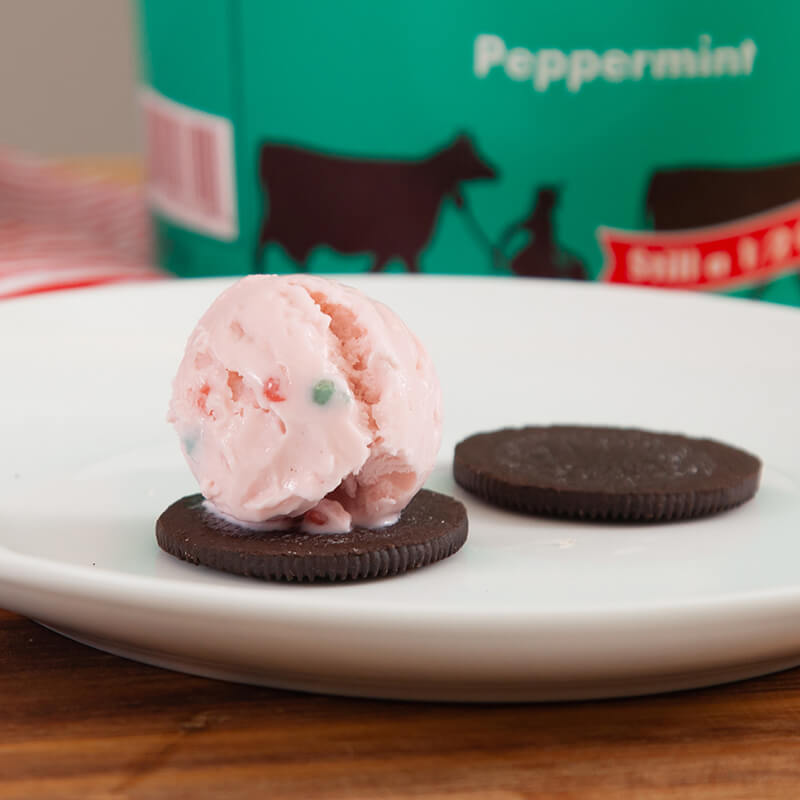 Blue Bell Peppermint ice cream scoop on chocolate cookie