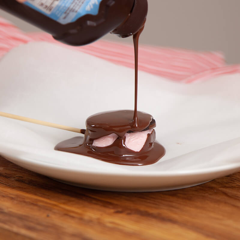 Blue Bell Peppermint ice cream covered with instant hard shell chocolate syrup