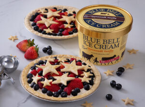 Ice cream pie with Blue Bell Homemade Ice Cream, strawberries, blueberries, raspberries, and star shaped pie pieces.